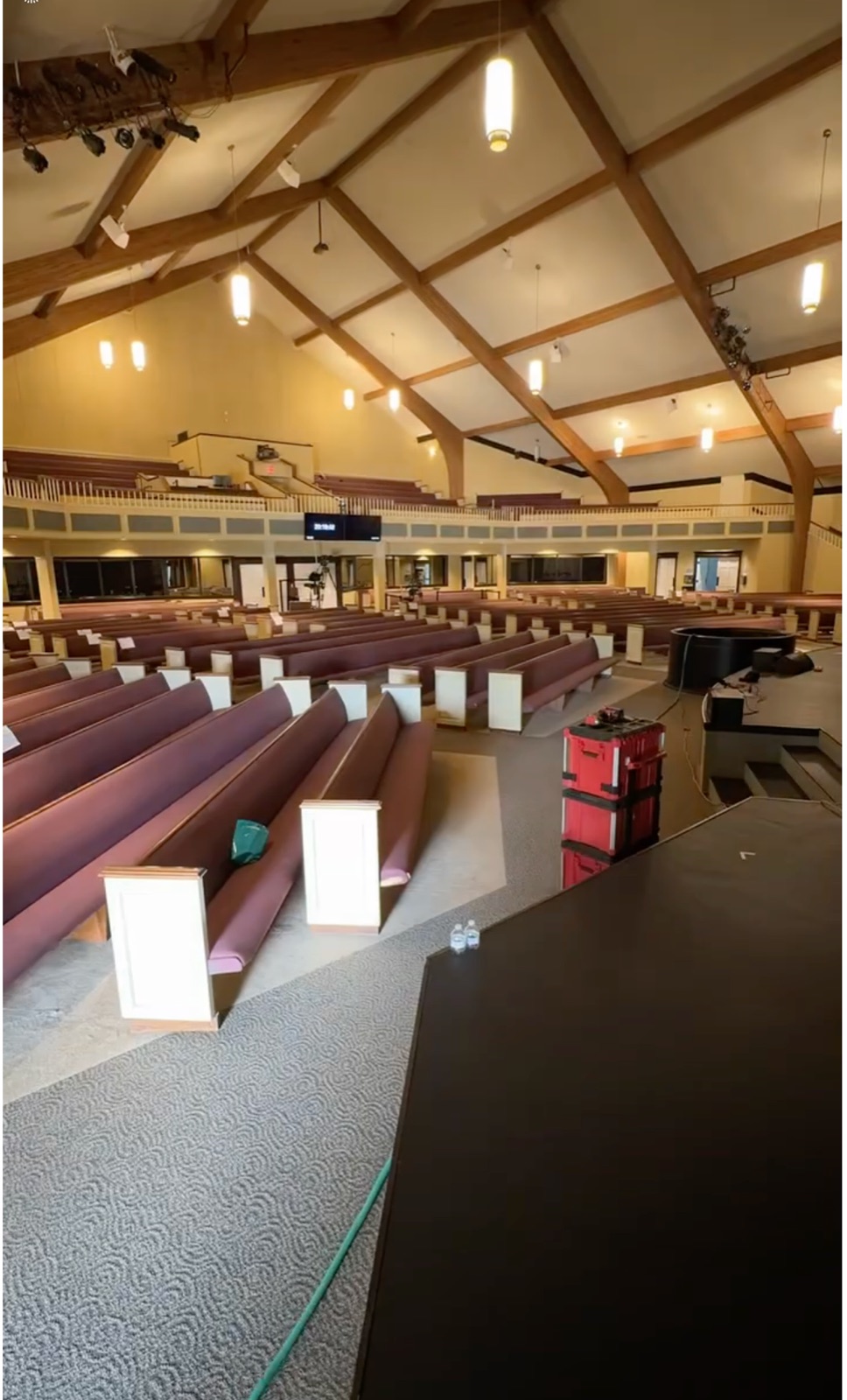 The Bridge Church auditorium before the remodel: original pews and stage